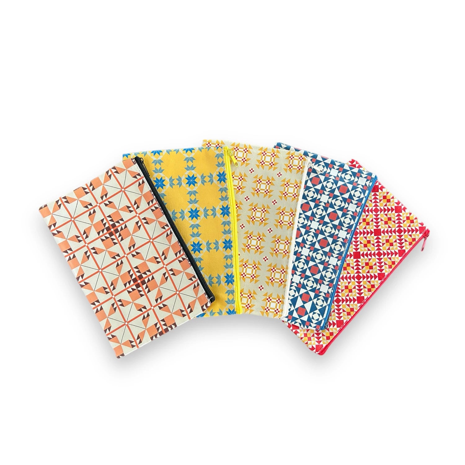 Set of five patterned notebooks on a white background
