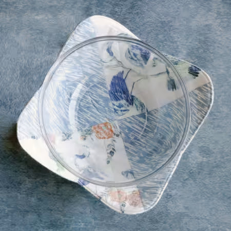 Glass bowl with floral pattern on a textured blue surface Color Blocked Bowl Cozy -Size 13" x 13"  Designed By Carolina Moore - Carmon's Quilt Shop