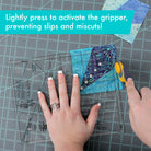 Person cutting fabric with scissors on a cutting mat, text overlay about activating a gripper. Creative Grids Quilt Ruler Kitty Cornered # CGRDH5 - Carmon's Quilt Shop