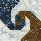 Quilt block with blue and brown patterns on a white background Creative Grids Square on Square Trim Tool 4in or 8in Finished Blocks Quilt Ruler # CGRJAW8 - Carmon's Quilt Shop