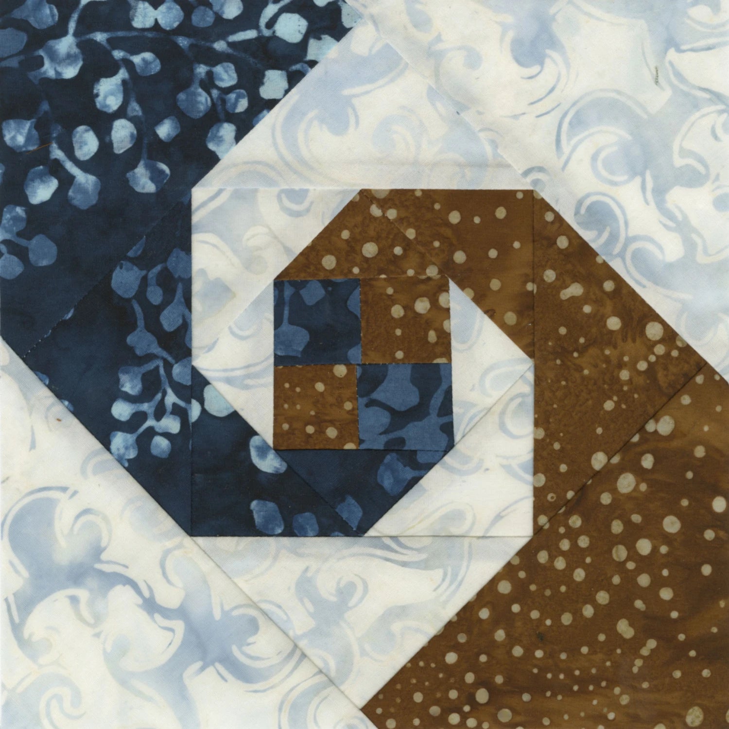 Quilt block with blue and brown patterns on a white background Creative Grids Square on Square Trim Tool 4in or 8in Finished Blocks Quilt Ruler # CGRJAW8 - Carmon's Quilt Shop