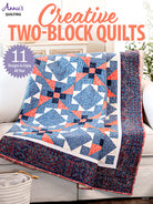 Quilt with two-block pattern on a couch, featuring Annie's Quilting branding.