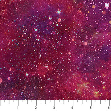 Fabric with a starry night sky pattern in pink and purple tones.