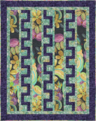 Floral quilt with geometric pattern on a dark background