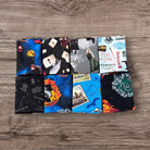 Collection of themed fabric swatches on a wooden surface
