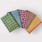 Four patterned fabric swatches arranged in a row on a light gray background