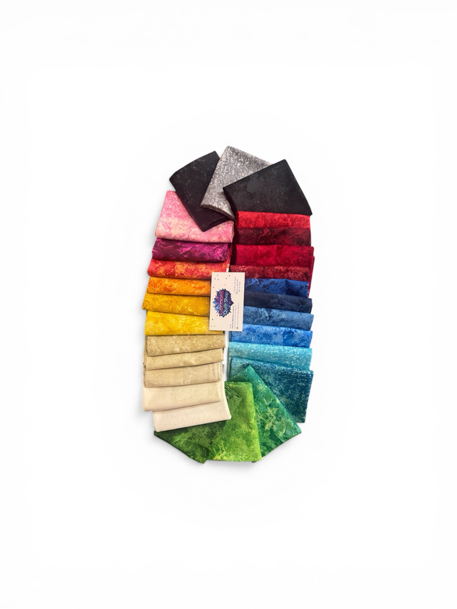 Set of colorful socks arranged in a fan-like pattern on a white Stonehenge Basics 28 Fat Quarter Bundle Northcott Carmon's Quilt Shopbackground