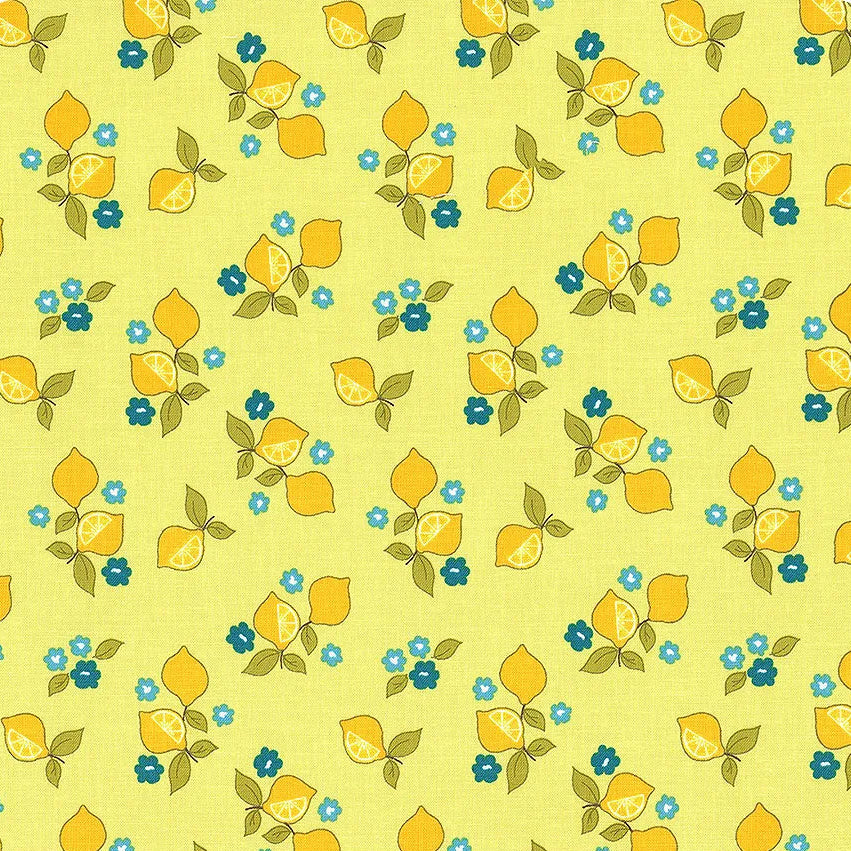 A yardstick with a floral pattern fabric, predominantly yellow with green leaves and blue flowers, displayed alongside it.