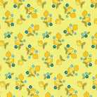 A yardstick with a floral pattern fabric, predominantly yellow with green leaves and blue flowers, displayed alongside it.
