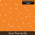 Carmon's Quilt Shop FIGO Fabrics orange cotton quilting fabric with a glow in the dark star pattern