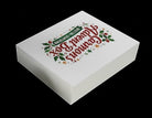 Carmon's Quilt Shop limited-edition holiday advent box with festive holly and star branding on a white gift box.