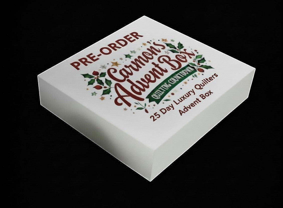 Carmon's Quilt Shop limited-edition 25-day premium quilter's advent box with festive holiday branding on a white box.