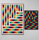 Carmon's Quilt Shop Aerodynamic quilt kits featuring rainbow arrow patterns on off-white and black backgrounds.