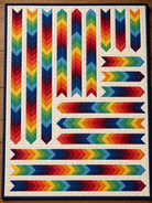 Carmon's Quilt Shop Aerodynamic quilt kit featuring a vibrant rainbow arrow pattern on an off-white background.