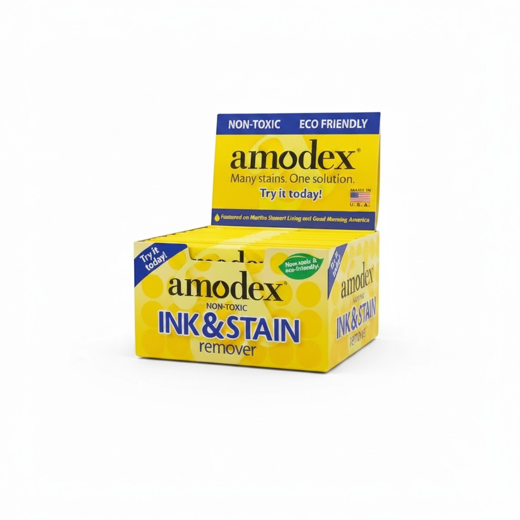 Carmon's Quilt Shop Amodex ink and stain remover trial pack in a yellow display box for fabrics and surfaces