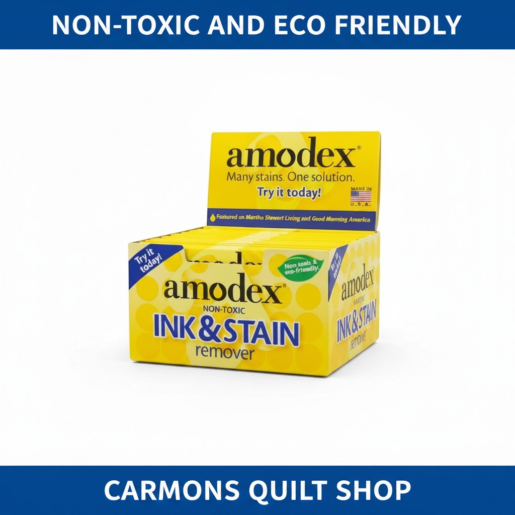Carmon's Quilt Shop Amodex ink and stain remover trial pack in a yellow display box for fabrics and surfaces