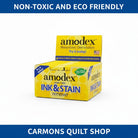 Carmon's Quilt Shop Amodex ink and stain remover trial pack in a yellow display box for fabrics and surfaces
