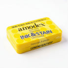 Carmon's Quilt Shop Amodex ink and stain remover trial pack in a yellow eco-friendly container
