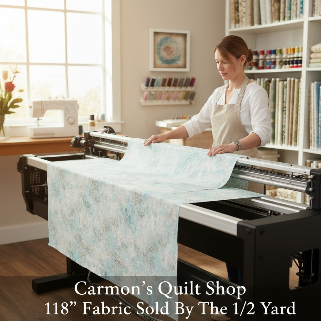 Carmon's Quilt Shop light aqua mottled texture 118 inch wide cotton quilting fabric on a longarm machine