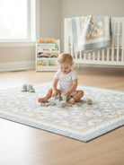 Carmon's Quilt Shop Baby Bears and Airplanes quilt pattern features a soft blue, cream, and beige patchwork design with diamond motifs and a border.