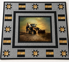 Carmon's Quilt Shop Backhoe Loader quilt kit featuring a construction panel with grey, black, and yellow star blocks.
