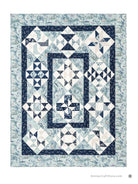 Carmon's Quilt Shop Mix & Match Quilt Sampler featuring blue and white geometric blocks and nautical fabric borders.