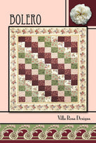 Carmon's Quilt Shop Bolero quilt pattern by Villa Rosa Designs featuring a floral patchwork design in pink and green.