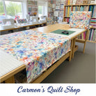 Carmon's Quilt Shop Butterfly Wishes cream 108-inch wide cotton quilt backing fabric with colorful butterfly print.