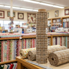 Carmon's Quilt Shop Figo Snowbound Carmel rustic plaid cotton fabric bolt on a table in a fabric store