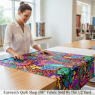 Carmon's Quilt Shop QT Fabrics Carnivale floral geometric cotton fabric with vibrant multi-colored pattern on black.