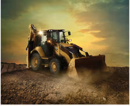 Carmon's Quilt Shop CAT backhoe loader cotton fabric panel featuring a yellow construction vehicle at sunset