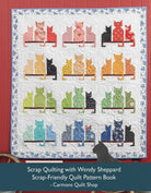 Carmon's Quilt Shop scrap quilt featuring colorful cat silhouettes on a white floral background