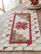 Carmon's Quilt Shop Christmas table runner with red and green star and geometric quilt patterns on a wooden table
