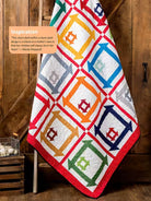 Carmon's Quilt Shop features a colorful churn dash quilt pattern from the Annie's Quilts to Make in a Weekend book.