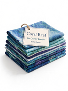 Carmon's Quilt Shop Coral Reef fat quarter bundle featuring blue and teal ocean-themed cotton fabrics for quilting.