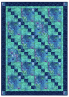 Carmon's Quilt Shop Coral Reef Turtles and Blue Fish quilt kit featuring ocean-themed patchwork in blue and green.
