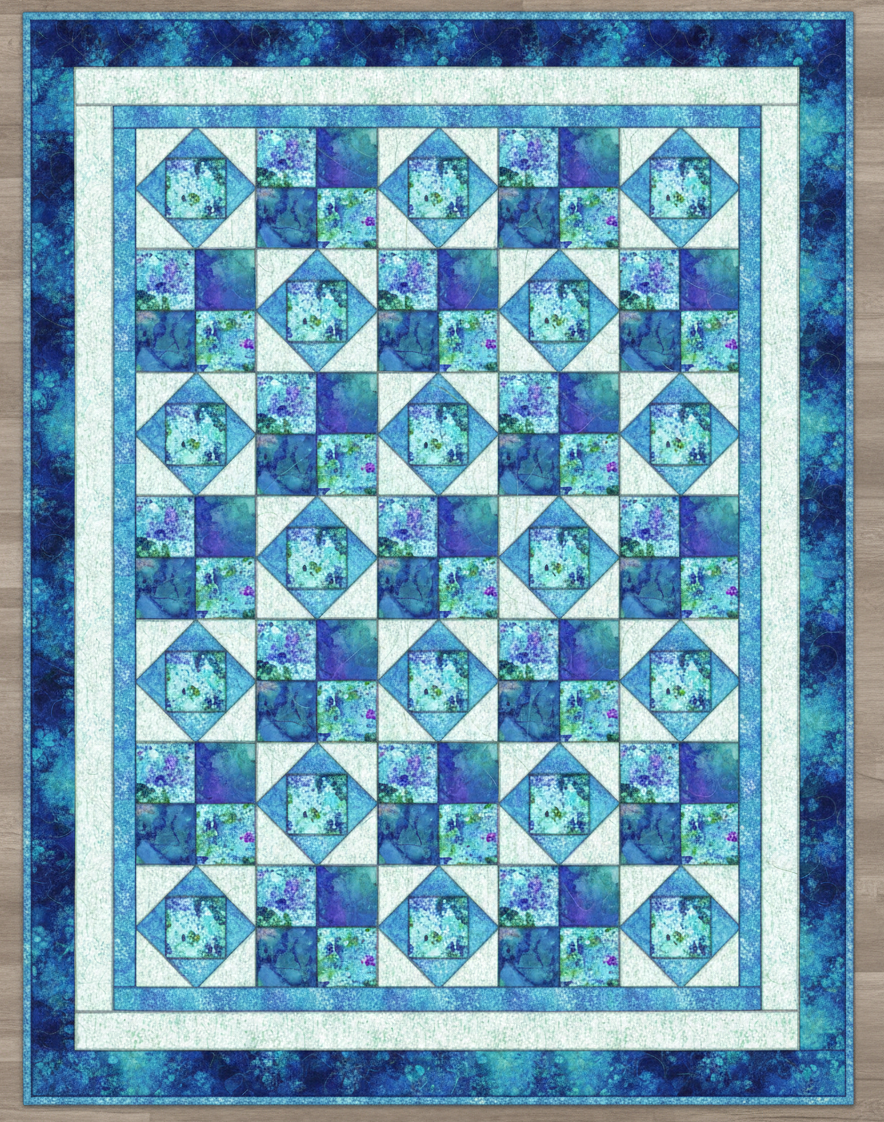 Carmon's Quilt Shop Coral Sea Span quilt kit featuring a geometric blue and white cotton pattern for baby quilts.