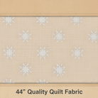 Carmon's Quilt Shop Light As Air cream cotton fabric with white floral pattern for quilting and sewing projects.