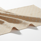 Carmon's Quilt Shop Robert Kaufman Light As Air cream cotton quilting fabric with delicate white floral pattern