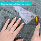 Carmon's Quilt Shop Creative Grids Kitty Cornered quilt ruler, 11" x 11", made of clear acrylic with black markings for quilting and sewing.