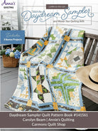 Carmon's Quilt Shop Daydream Sampler quilt pattern book featuring a colorful pieced quilt draped on a wooden bench