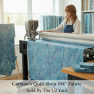 Carmon's Quilt Shop QT Fabrics denim blue mottled 108-inch wide cotton quilting fabric on a longarm machine
