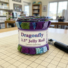 Carmon's Quilt Shop Dragonfly Wonder 2.5 inch jelly roll featuring 40 pre-cut cotton fabric strips in floral prints.