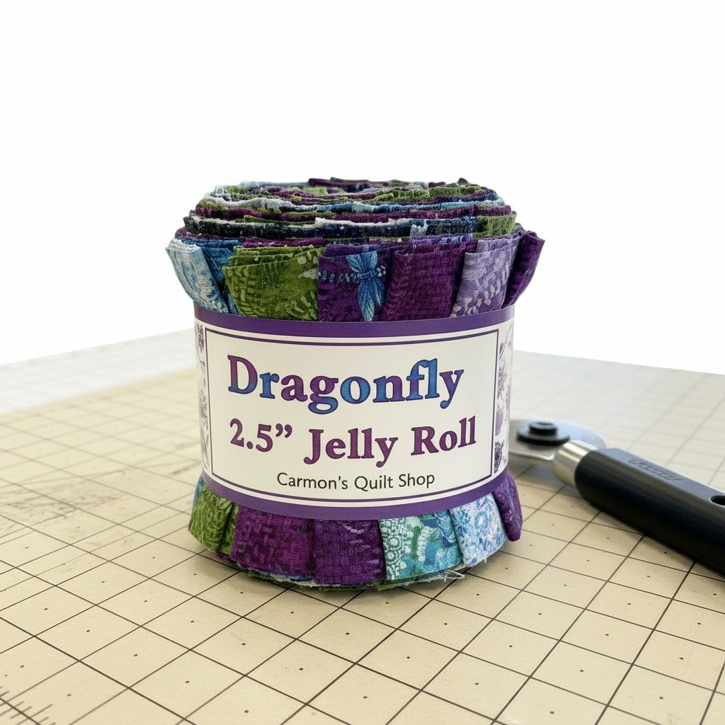Carmon's Quilt Shop Dragonfly Wonder 2.5 inch jelly roll featuring 40 pre-cut cotton fabric strips in purple and green