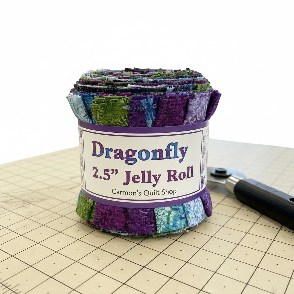 Carmon's Quilt Shop Dragonfly Wonder jelly roll featuring 40 pre-cut cotton fabric strips in purple and green tones.