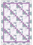 Carmon's Quilt Shop Dragonfly Wonder City Lights lavender quilt kit with floral and geometric block patterns.