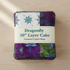Carmon's Quilt Shop Dragonfly Wonder 10-inch layer cake featuring 40 cotton fabric squares with dragonfly prints.