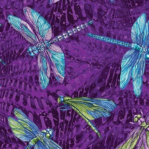 Carmon's Quilt Shop Dragonfly Wonder cotton fabric featuring vibrant blue and green dragonflies on a purple background