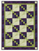 Carmon's Quilt Shop Dragonfly Wonder City Lights 3-yard quilt in green and purple geometric cotton fabric