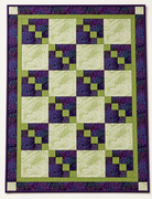 Carmon's Quilt Shop Dragonfly Wonder City Lights 3-yard quilt in purple and green geometric cotton fabric